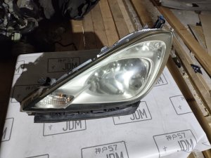 Фара левая HONDA FIT